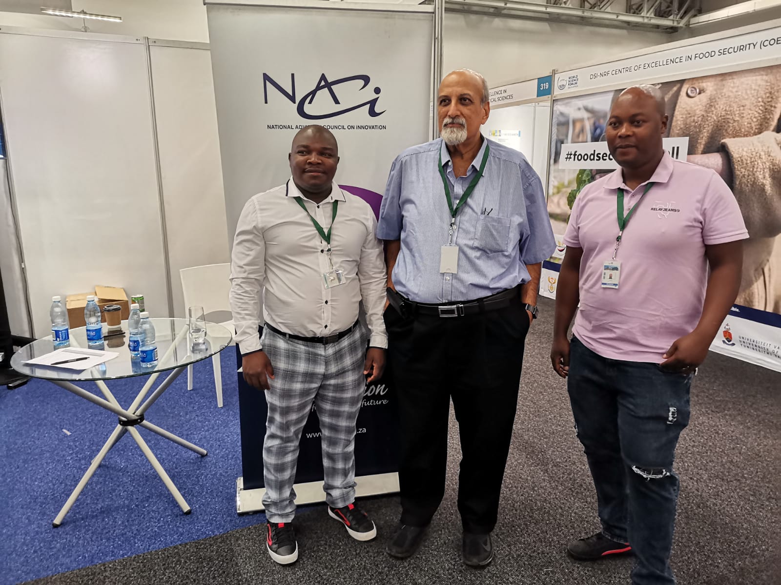 Renowned Prof Salim Abdool Karim (Centre) stopped by the NACI Stall at the World Science Forum
