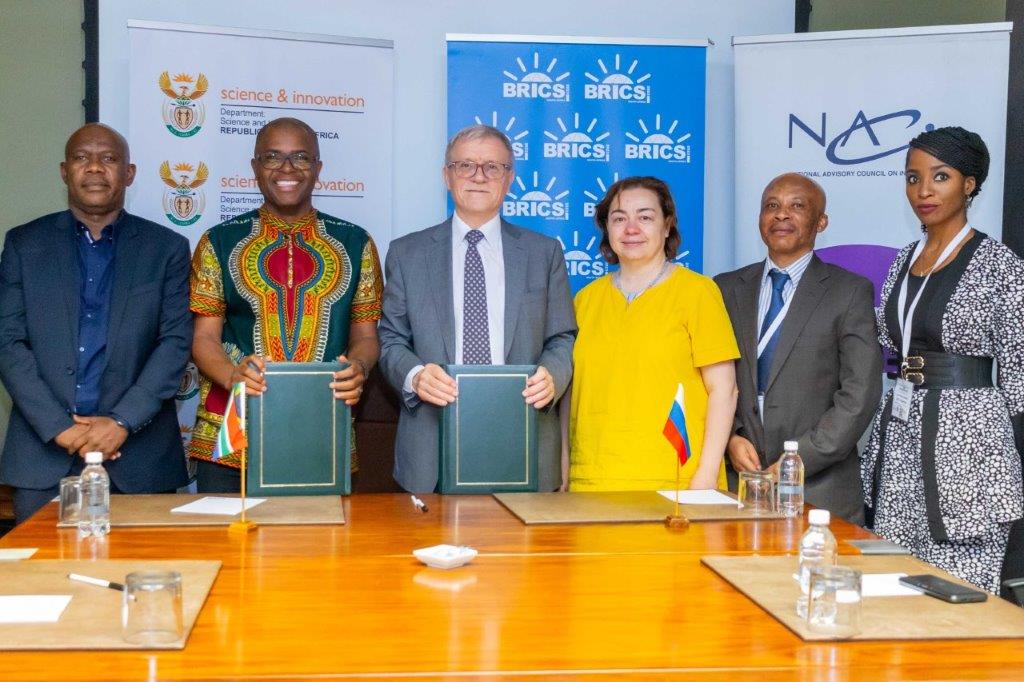 NACI Chair, Mr Tilson Manyoni (1st from left) with NACI CEO, Dr Mlungisi Cele (2nd from left) and Prof Alexander Sokolov (Centre) of the Russian National Research University Higher School of Economics (HSE University) at the signing of the MoU between the two institutions held on the 4 - 5 December 2023 at the CSIR International Convention Centre, Pretoria, South Africa