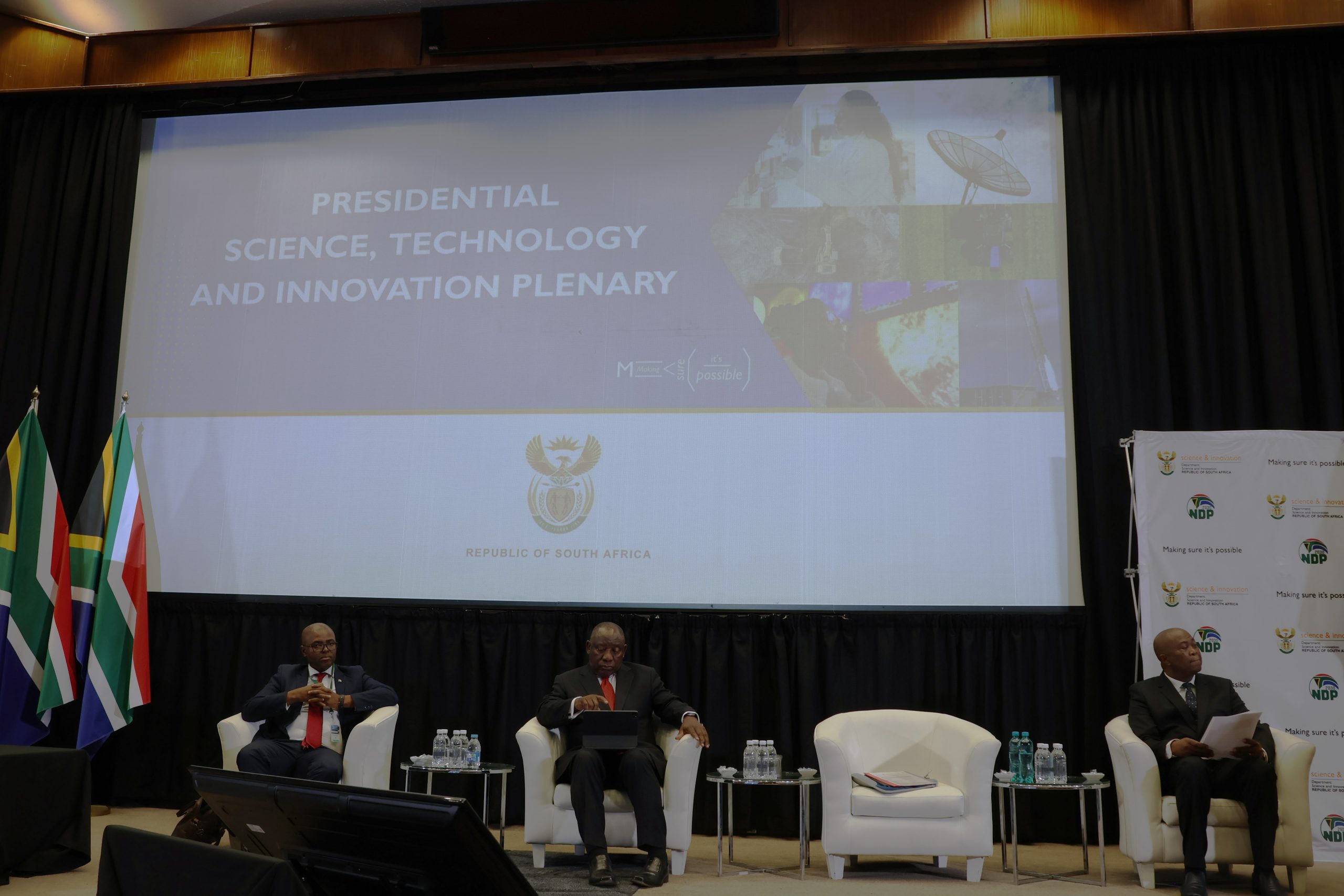 NACI CEO, Dr Mlungisi Cele sitting next to President Cyril Ramaphosa during the Presidentail Plenary on Science, Technology and Innovation at CSIR International Convention Centre, Pretoria, South Africa